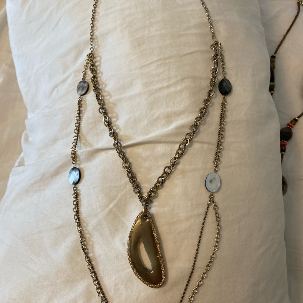 Double strand gold tone necklace.